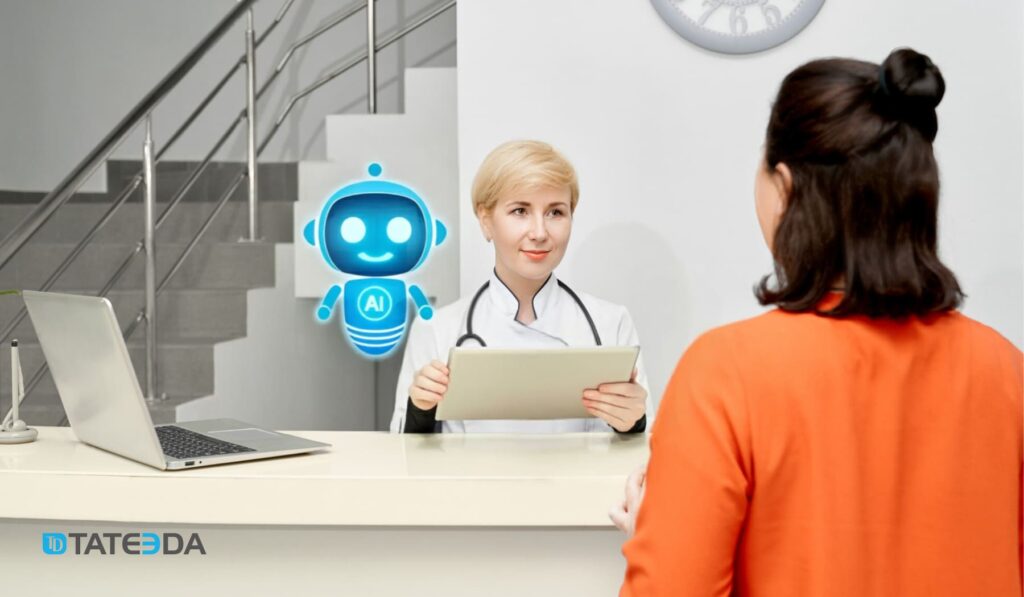 Clinic front desk with a clinician speaking to a patient and a blue AI assistant icon nearby, representing custom ambulatory management software development for automated check-in, eligibility, and scheduling. | TATEEDA